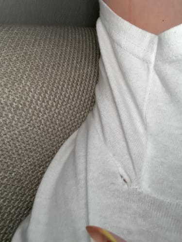 Customer's close-up of a hole under the armpit of their classic tee.
