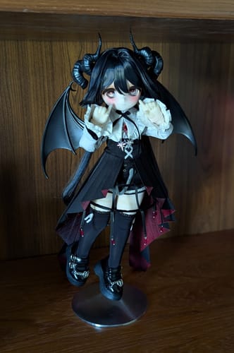Customer's TinyFox 'Grafa' action figure posed, showing its black horns, wings, and gothic outfit.