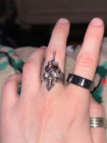 Customer wearing the intricate HALLUCINOGENIC NIGHTMARE RING on their middle finger, showing the fit.