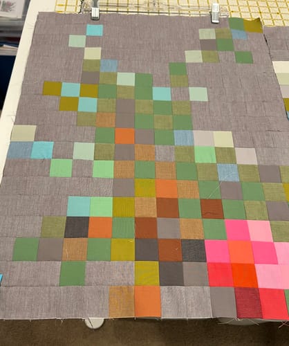 Customer's Tilda Flower Branch Quilt Kit being assembled, showing the pixelated design on the taupe background fabric.