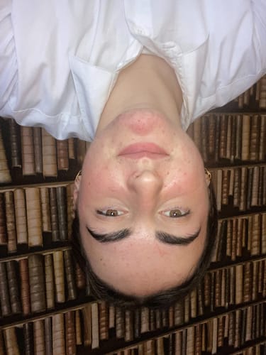 Reviewer's face showing reduced redness and clearer skin after using the Intermediate Acne Program™.