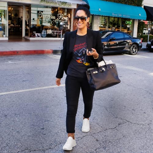 Customer styles the white CloudStep™ Comfort Sneakers with a blazer and pants for a modern look.
