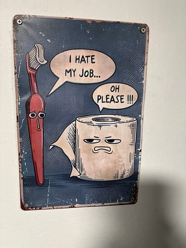 Customer's 'I Hate My Job Oh Please Funny Wall Art' mounted on a white wall in a bathroom.