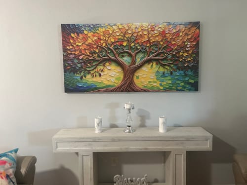 Reviewer's vibrant Tree Of Life Wall Art with a textured look, hanging on a wall above a console table.