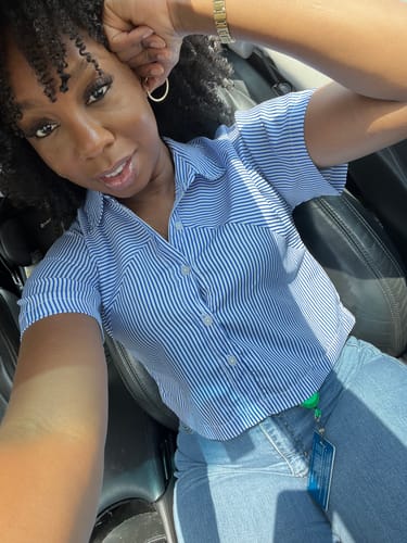 Reviewer showing her defined, curly hair after using the Tropical Oasis Hair Gel.