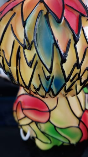 Close-up of the customer's Highland Cow night light, showing a glossy painted finish with thick black outlines, not a fur-like texture.