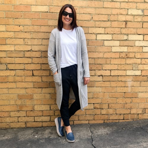 Reviewer wearing blue Soleva loafers with a white platform sole, styled with a casual outfit.