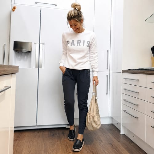 Reviewer wearing black Soleva loafers with a white platform sole as part of a casual outfit.