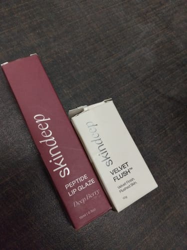 Reviewer's packaging for the VELVET FLUSH blush, shown next to the Peptide Lip Glaze box.