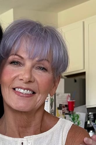 Close-up of a smiling reviewer showing her smooth, soft-looking skin after using F-Balm.