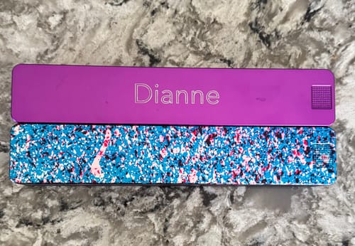 Reviewer comparing their new purple personalized Vitamin Case to their older, speckled vitamin case.