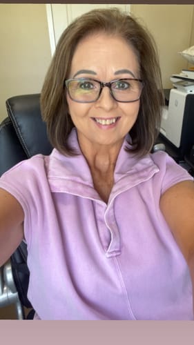 Reviewer wearing the matching lavender top from the Weekend Retreat short set.