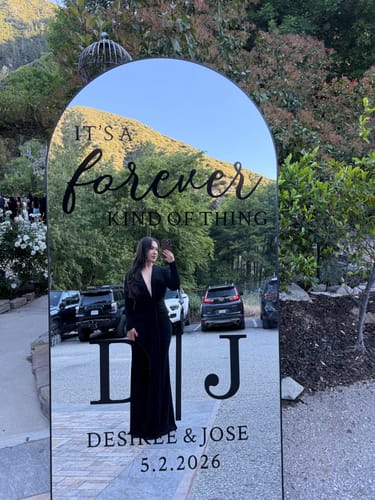 Reviewer taking a mirror selfie while wearing the black Leilani Maxi Dress at an event.