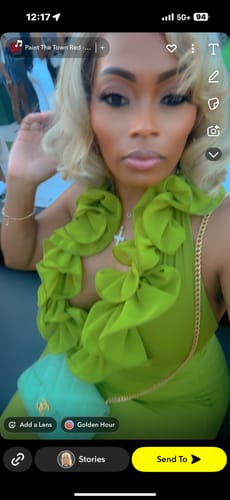 Close-up of a reviewer wearing the green Naked Ruffle Halter Maxi Dress, highlighting the ruffled neckline.