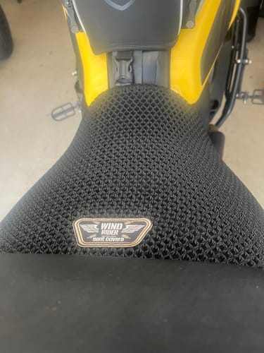 Customer's close-up of the black mesh Wind Rider Seat Cover installed on a motorcycle seat.
