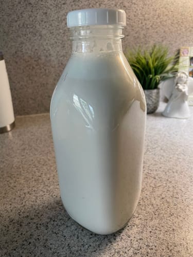 Customer's homemade almond milk in a glass bottle, sweetened with Organic Mini Medjool Dates.