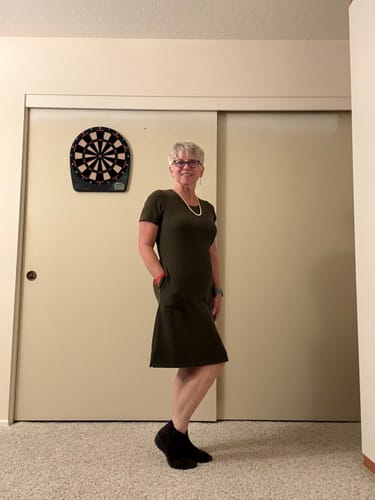Reviewer wearing the olive green Harlowe dress from their Mystery Bag.