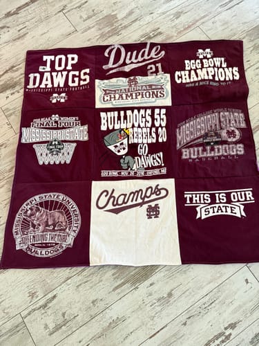 Customer's commemorative Project Repat T-Shirt Quilt made from maroon and white Mississippi State sports t-shirts.