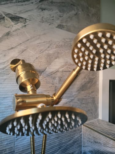Customer's brass Shower Head Filter installed with dual shower heads in a newly remodeled, tiled bathroom.