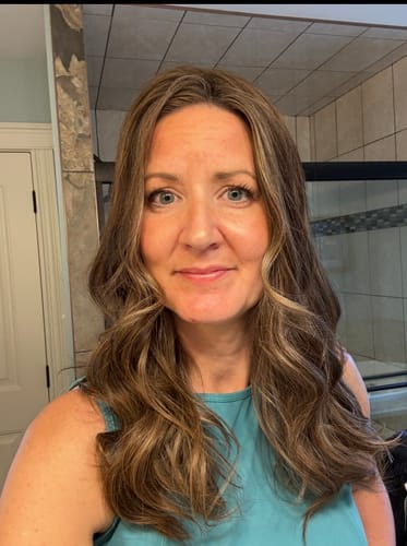 Reviewer showing the soft waves and dimensional color of her Mocha Latte Lace Topper.
