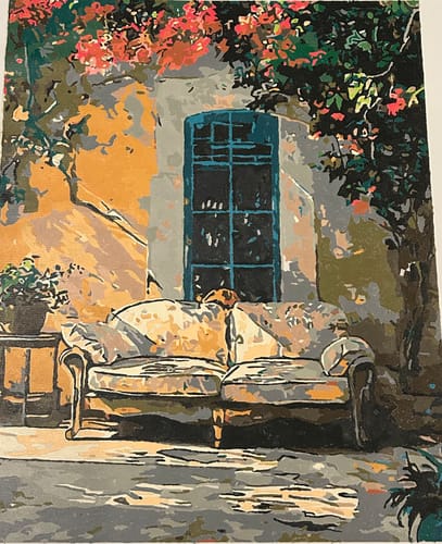 Customer's completed Mediterranean Serenity paint-by-numbers project showing a rustic couch and window scene.