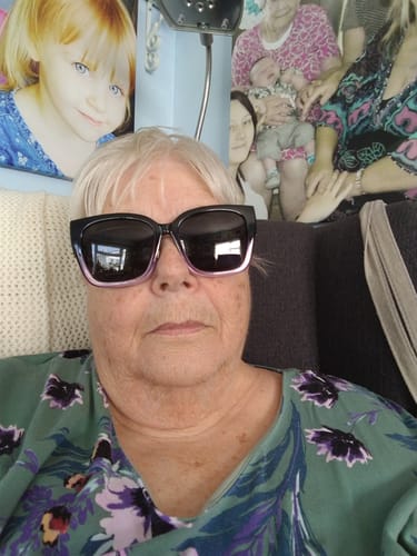 Customer wearing the Polarized Fit Over Sunglasses, which successfully conceal her prescription glasses.