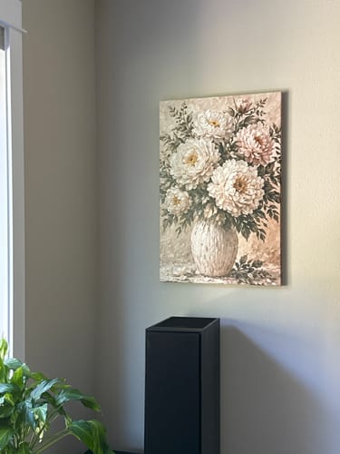 Customer's White Peony Bouquet canvas art hanging on a wall in their living room.