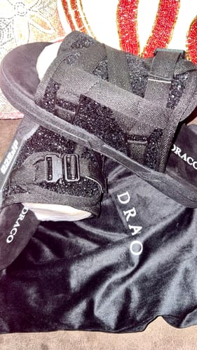 Customer's sparkly black SuperStar DracoSlides shown with their drawstring bag.
