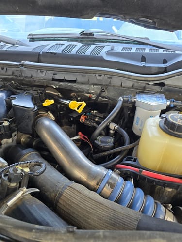 Close-up of the reviewer's installed SPE Motorsport Fuel Filter System manifold in a clean truck engine bay.