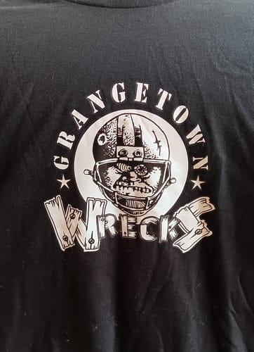 Close-up of a reviewer's custom-printed black unisex t-shirt with a white 'Grangetown Wrecks' logo on the chest.