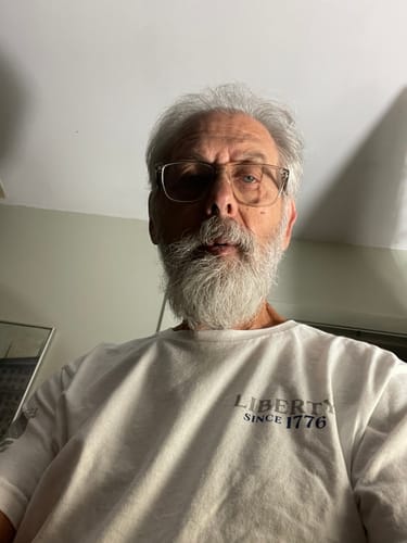 Customer wearing the white 250 Years of Heroes tee with the 'Liberty Since 1776' chest logo.
