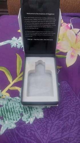 Reviewer showing the opened, empty packaging box for their Sultan perfume.