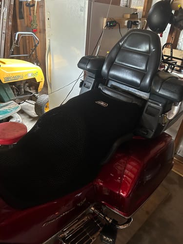 Customer's black Wind Rider Seat Cover installed on the seat of their red GL1500 motorcycle.