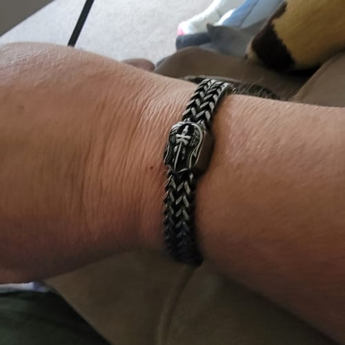 Customer showing the fit of the woven St. Michael Defend Us Bracelet on their wrist.
