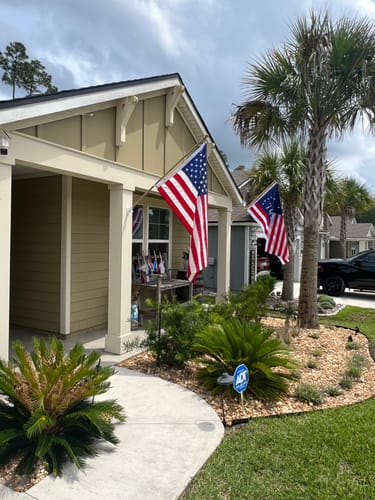 A different angle of the reviewer's Bennington Flag flying from their home's porch.