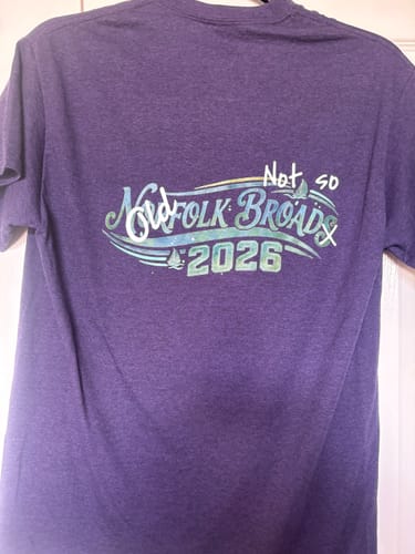 Customer's purple unisex t-shirt with a custom printed graphic on the back reading 'Not so Old Norfolk Broads 2026'.