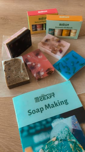 Customer shows colorful soaps made with This Month's Craft Subscription Box, displayed with the instruction booklet.