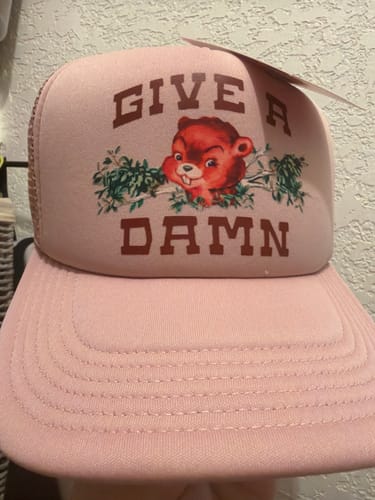 A customer's pink Give A Damn Trucker Hat with a detailed graphic of a beaver.