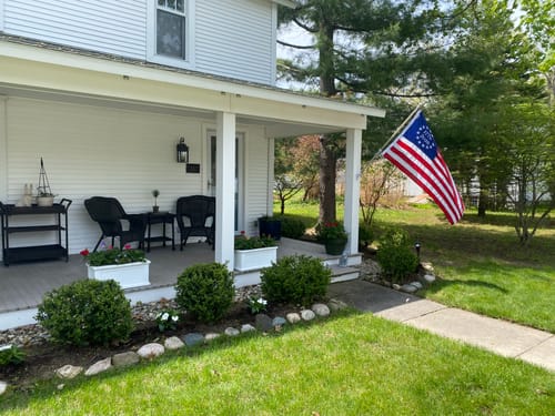 Reviewer's commemorative Betsy Ross flag flying from the porch of their house.