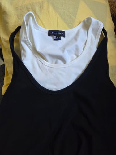 Customer's 2 in 1 Sleeveless Midi Dress showing the separate black outer layer and white inner top laid flat.