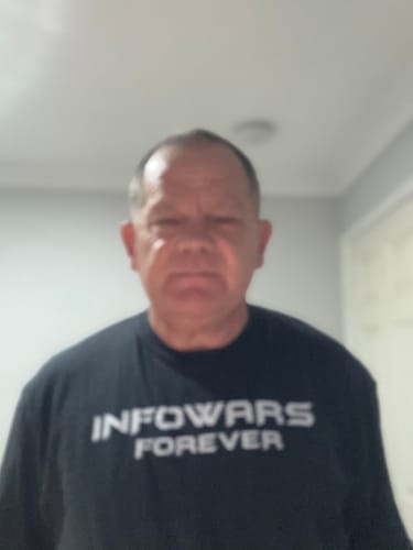 Customer photo review of Vintage Infowars Logo Fundraiser T-Shirt
