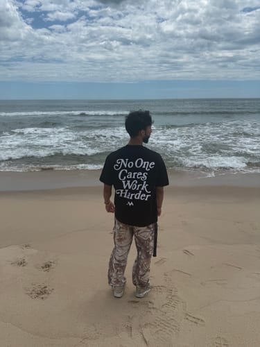 Customer photo review of 'NO ONE CARES WORK HARDER' TEE - JET BLACK