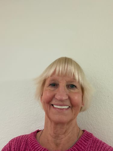 Customer smiling and showing off her bright white Pop On Veneers.