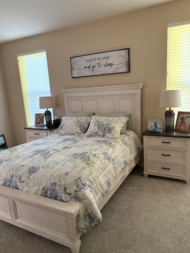 Customer's 'Give It To God And Go To Sleep' sign hanging on a wall above the bed in their bedroom.
