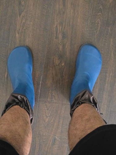 Customer's view looking down at their blue Brisk Ⅰ - Barefoot Rain Boots, showing the wide toe box.
