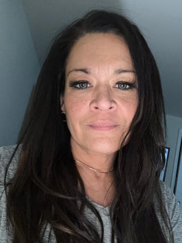 Customer showing the Laurel Gray contact lenses, which appear natural on her dark brown eyes.