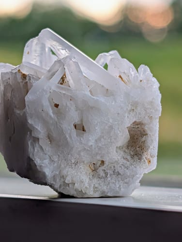 Customer's close-up of the Clear Quartz Crystal Cluster, showing its translucent points and rough white base.