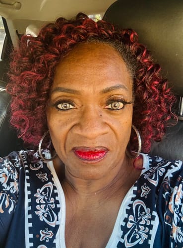 Reviewer takes a close-up selfie showing the vibrant Shailagh Brown contact lenses in their eyes.
