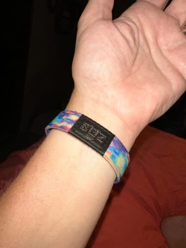 Customer's colorful Either Way, I'll Be Okay Bracelet shown on their wrist against a dark background.