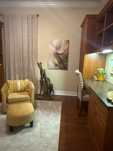 Customer's Taupe Tides Abstract Wall Art hanging on a beige wall in a home office.